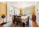 Bright dining room featuring hardwood floors, large windows, and a traditional dining set at 2785 Old Sewell Rd, Marietta, GA 30068