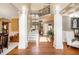 Elegant foyer featuring hardwood floors, decorative columns, and a staircase leading to the second floor at 2785 Old Sewell Rd, Marietta, GA 30068