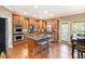 Open concept kitchen with a large island, stainless steel appliances, and eat-in dining area at 2785 Old Sewell Rd, Marietta, GA 30068