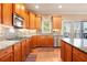 Spacious kitchen featuring granite countertops, wood cabinets, and stainless steel appliances at 2785 Old Sewell Rd, Marietta, GA 30068