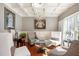 Cozy living room with coffered ceiling, hardwood floors, elegant furnishings, and plenty of natural light at 2785 Old Sewell Rd, Marietta, GA 30068