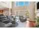 Cozy living room featuring a large window and a comfortable leather sectional sofa at 2785 Old Sewell Rd, Marietta, GA 30068