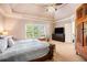 Bedroom with a ceiling fan and a large window allowing natural light at 2785 Old Sewell Rd, Marietta, GA 30068