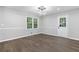 Well-lit dining room area features wood floors and a contemporary light fixture at 353 Old Rosser Rd, Stone Mountain, GA 30087