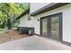 Exterior view with a door leading to the backyard and an AC unit at 353 Old Rosser Rd, Stone Mountain, GA 30087