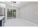 Bright dining area with a sliding glass door and modern lighting at 612 Saddlewood Dr, Lawrenceville, GA 30043