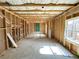 Bright unfinished basement with framed walls, rough window openings, and insulated ceiling at 66 Pine Creek Ct, Dallas, GA 30157