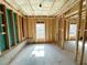 Unfinished basement showing concrete foundation, wooden framing, and a small window at 66 Pine Creek Ct, Dallas, GA 30157