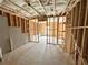 Spacious unfinished basement with concrete walls, wooden frame, and ceiling insulation at 66 Pine Creek Ct, Dallas, GA 30157