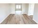 Hallway with wood-look floors and natural light at 66 Pine Creek Ct, Dallas, GA 30157