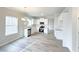 Bright kitchen and eating area with white cabinets and stainless steel appliances at 66 Pine Creek Ct, Dallas, GA 30157