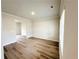 Bright living room with light beige walls and hardwood floors at 66 Pine Creek Ct, Dallas, GA 30157