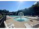 Community pool features a mushroom fountain and plenty of seating for residents to enjoy at 66 Pine Creek Ct, Dallas, GA 30157