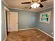 Bedroom featuring a ceiling fan and a window view at 1504 Sycamore Nw Dr, Kennesaw, GA 30152