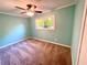 Bedroom with a ceiling fan and natural light through a window at 1504 Sycamore Nw Dr, Kennesaw, GA 30152
