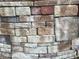 Close up of the home's retaining wall, made of colorful stacked stone bricks at 1504 Sycamore Nw Dr, Kennesaw, GA 30152