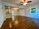 Spacious living room with hardwood floors and an open layout that flows into the kitchen area at 1504 Sycamore Nw Dr, Kennesaw, GA 30152