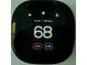 Smart thermostat displaying the current temperature with energy-saving features at 1504 Sycamore Nw Dr, Kennesaw, GA 30152