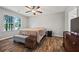 Comfortable bedroom featuring wood-look flooring and a ceiling fan at 28 Fawn Ct, Sharpsburg, GA 30277