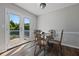 Dining area with French doors leading to deck with wood-look flooring at 28 Fawn Ct, Sharpsburg, GA 30277