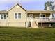 Charming home featuring a covered front porch, freshly manicured lawn, and colorful flower bed along the foundation at 28 Fawn Ct, Sharpsburg, GA 30277