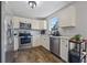 Well-equipped kitchen with stainless steel appliances and ample cabinet space at 28 Fawn Ct, Sharpsburg, GA 30277