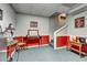 A partially finished basement space with sports-themed decor and cozy seating at 764 Whitby Dr, Douglasville, GA 30134