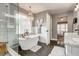 Bathroom featuring a freestanding tub, white tiled walls, tile floors, and modern chandelier at 764 Whitby Dr, Douglasville, GA 30134