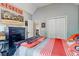 This bedroom features a large closet, striped bedding, and playful decor at 764 Whitby Dr, Douglasville, GA 30134