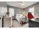 Neutral bedroom featuring light carpet, grey walls, and vintage white dresser and full sized bed at 764 Whitby Dr, Douglasville, GA 30134