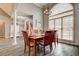Dining room featuring a wooden table, large window, and contemporary decor at 764 Whitby Dr, Douglasville, GA 30134