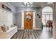 Bright foyer with an open door and stylish decor at 764 Whitby Dr, Douglasville, GA 30134