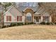 Charming single-Gathering home with a well-manicured lawn and inviting front porch at 764 Whitby Dr, Douglasville, GA 30134