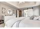 Bright main bedroom features a white dresser and barn door to the ensuite bath with double vanity at 764 Whitby Dr, Douglasville, GA 30134