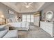 Bright main bedroom featuring neutral walls, carpet, vaulted ceiling, and sitting area by windows at 764 Whitby Dr, Douglasville, GA 30134