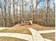 A community playground with a slide and climbing structure is fenced for safety and fun for the residents at 764 Whitby Dr, Douglasville, GA 30134