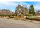 The Canterbury Lane entrance features a brick sign surrounded by manicured landscaping, creating an inviting first impression at 764 Whitby Dr, Douglasville, GA 30134