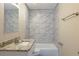 Bathroom vanity with a granite countertop and tiled shower with a tub at 858 Commodore Nw Dr, Atlanta, GA 30318