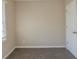 Neutral bedroom showing the door to the closet and the bright window at 858 Commodore Nw Dr, Atlanta, GA 30318