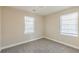 Bright bedroom with two bright windows and neutral carpet at 858 Commodore Nw Dr, Atlanta, GA 30318