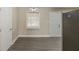 Cozy dining area featuring stylish floors, a modern light, and stainless steel appliances at 858 Commodore Nw Dr, Atlanta, GA 30318