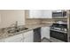 Updated kitchen featuring granite counters, stainless appliances, and ample cabinet space at 858 Commodore Nw Dr, Atlanta, GA 30318