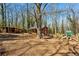 Large backyard complete with playset, chicken coop, and small house for all manner of outdoor activity at 105 Huskins Rd, Canton, GA 30115