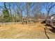 Expansive backyard with a full wooden fence, perfect for recreation and activities at 105 Huskins Rd, Canton, GA 30115