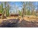 Sizeable backyard featuring a chicken coop and small house with a big tree at 105 Huskins Rd, Canton, GA 30115