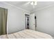 Bedroom with laundry closet and ceiling fan at 105 Huskins Rd, Canton, GA 30115