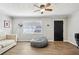 Bright and airy living room featuring modern flooring, a comfortable beanbag, and neutral walls at 105 Huskins Rd, Canton, GA 30115