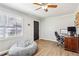 Comfortable living room features a beanbag chair, modern flooring, and a neutral color palette at 105 Huskins Rd, Canton, GA 30115