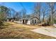 Exterior view of this residence includes a driveway and back deck at 105 Huskins Rd, Canton, GA 30115