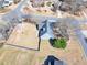 Aerial view of home with a fenced-in backyard featuring a shed and mature trees at 1270 Platinum Dr, Hoschton, GA 30548